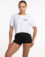 The Crop Tee - White - Odyssey - Left Chest Stacked - Black