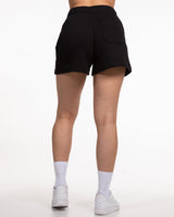 The Womens Sweat Shorts - Black - Team Ariana - Left Leg Stacked - White