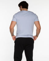 The Mens Tee - Powder -  Odyssey Performance - Center Chest Stacked W/ Star - White