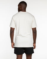The Mens Tee - Off White - Odyssey - Center Chest Stacked - Black