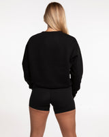 The Womens Crewneck - Black - Ignite Barre - Center Chest Stacked - White Printed