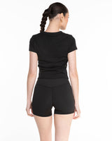 The Micro Rib Baby Tee - Black - Ignite Barre - Center Chest -  White Printed