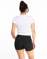 The Micro Rib Baby Tee - White - Ignite Barre - Center Chest - Black Printed