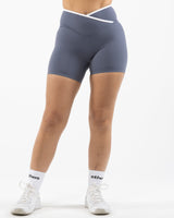 The Whole You Wellness - The Piped Crossover Short - Petrol Blue