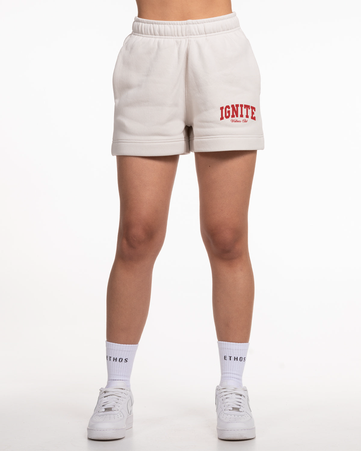 The Womens Sweat Shorts - Bone - Ignite Barre - Left Leg Stacked - Red Printed